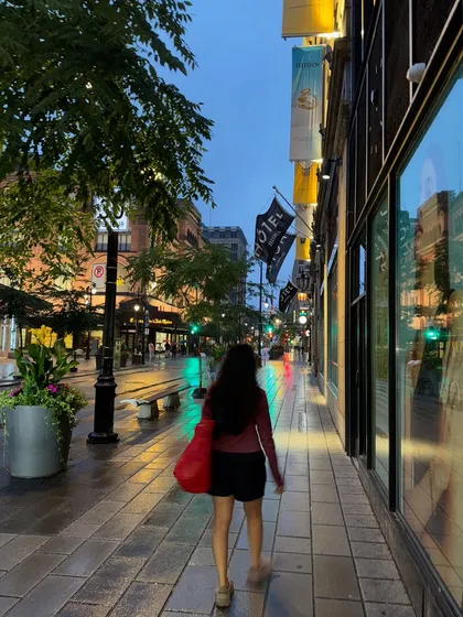 A "follow me" style shot walking down a wet street in Montréal, creating an engaging and personal perspective.