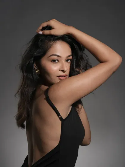 This pose demonstrates how the makeup enhances the model's features without masking them. The focus is on clean lines, balanced tones, and a healthy skin texture that looks authentic and polished.