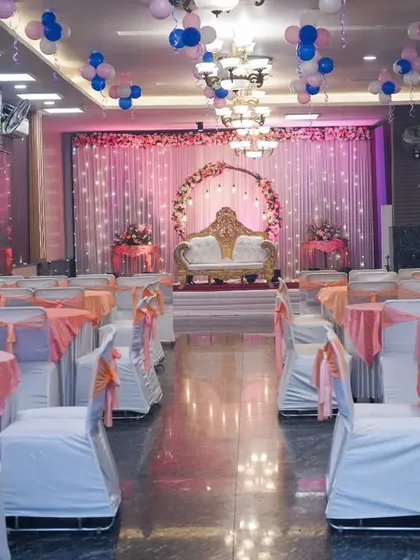 Another shot of the event space, showing the stage and table settings. Our event photography service documents the entire setup.
