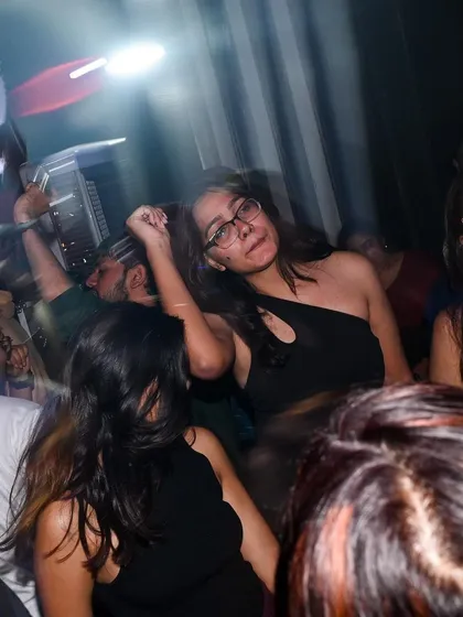 The motion and energy of the dance floor captured in a dynamic, slightly blurred shot.