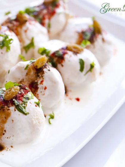 Soft and spongy dahi vadas soaked in creamy yogurt and topped with sweet and spicy chutneys. This classic North Indian chaat is a cooling and delightful addition to any wedding menu, especially for daytime events.