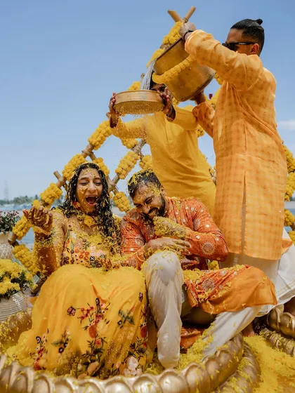 The pure, unadulterated joy of a Haldi ceremony. We love capturing the energy when families come together for this vibrant ritual, like this unforgettable moment from Sparsha and Karthik's lakeside celebration.