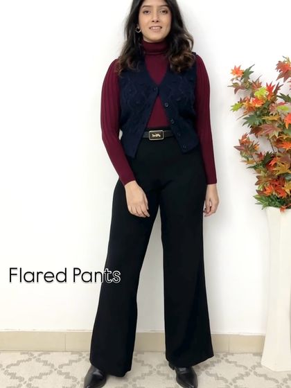 One great alternative to leggings is flared pants. Paired here with a turtleneck and a vest, they create a sophisticated and elongated silhouette for a polished winter look.