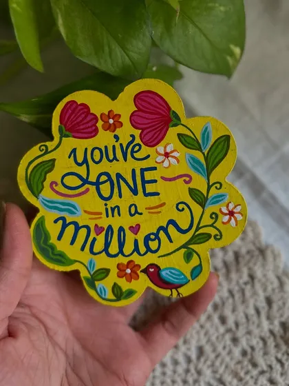 A 'You're one in a million' floral magnet, perfect for telling someone how special they are.