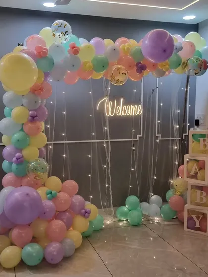 Another full view of the charming pastel rainbow welcome home decoration.