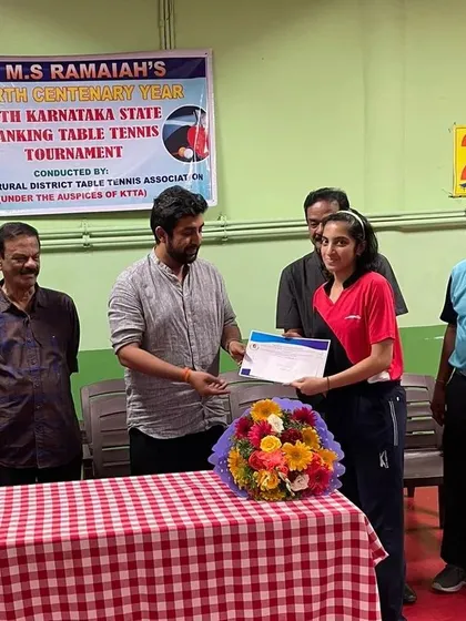 Parnavi H A receiving her certificate for her U15 Girls Runner-Up performance at the MSR State Ranking Tournament.