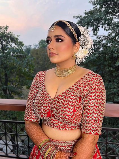 The happiest day of your life deserves the perfect makeup. This bride is glowing in her red lehenga, with a look that is both beautiful and timeless.