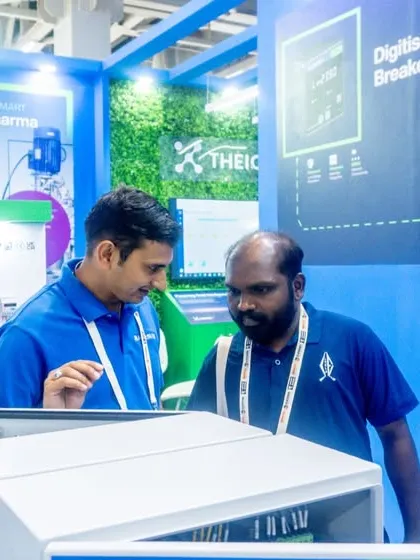 An interactive discussion at our ELECRAMA 2025 booth. Our team member explains the technical details of our source changeover systems to an interested visitor.