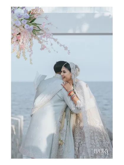 A hug of reassurance and joy right at the mandap, with the ocean as their witness. We capture the emotions just before they become husband and wife.