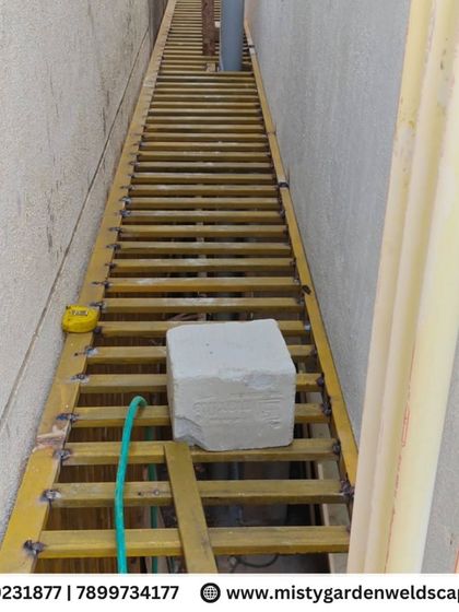 The framework of a long safety grill during fabrication. Each bar is carefully measured and placed to ensure consistent spacing and a professional look.