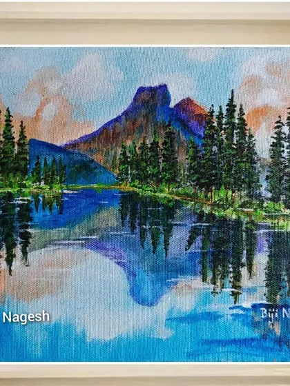 A landscape painting featuring a mountain, a calm lake, and their perfect reflection. I use acrylics to capture the serene beauty of such scenes, making them a peaceful addition to any home decor.