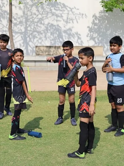 Players discussing strategy during a break. We encourage our players to think critically about the game and communicate effectively with their teammates.