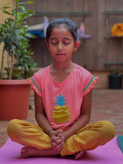 This young student is in a state of quiet contemplation. By starting at a young age, we can help children build a strong foundation of inner silence. This practice is a blessing that protects them from the confusion and unhappiness of a life lost in external pleasures.
