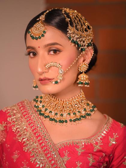 The complete look with the nath and passa. Every element comes together to create a stunning and cohesive bridal style.