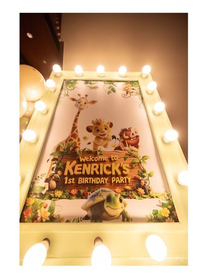 A grand, illuminated welcome sign for Kenrick's 1st Birthday Party. Featuring characters from The Lion King, this marquee-style sign creates an exciting entrance for a jungle-themed event.