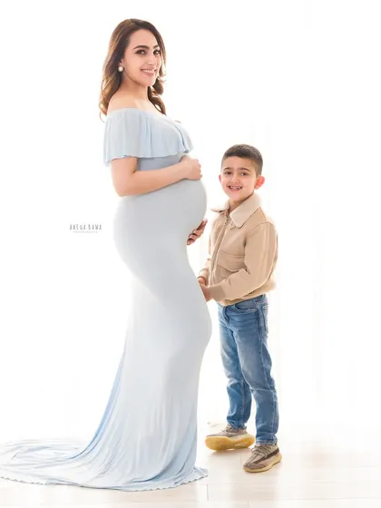 The journey to motherhood is a story of quiet strength and beautiful anticipation. Here, a mother-to-be shares a gentle moment with her son, a preview of the love that's about to multiply. This is a classic maternity portrait from my Gurgaon studio.
