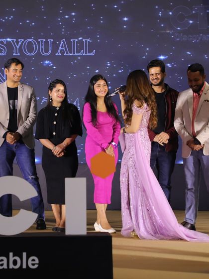 Engaging with the team on stage during a corporate annual day. I use humor and interactive games to make these events feel like a real celebration of the company's success.