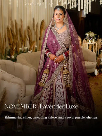 A Lavender Luxe bridal look. This style features a royal purple lehenga, shimmering silver details, and cascading kalire for a majestic feel.