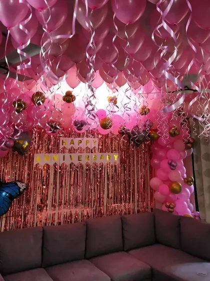 Another view of the pink-themed anniversary living room decoration.