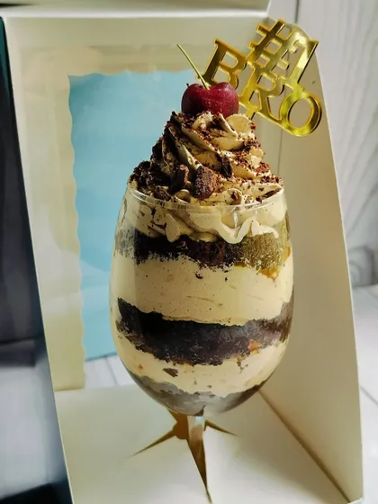 My Mocha Mirage Delight, created specially for Rakhi. It's an elegant dessert glass layered with chocolate cake, coffee mousse, almond praline, caramel, and chocolate chunks.