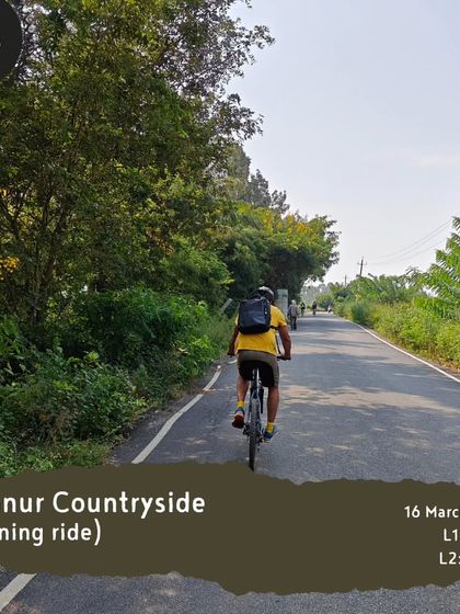 A rider enjoys the lush green surroundings on our 'Hennur Countryside' evening tour.