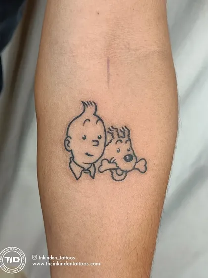 A nostalgic fine-line tattoo of Tintin and his dog, Snowy. This piece captures the essence of the beloved cartoon characters with clean, simple outlines, perfect for any fan of the classic adventure series.