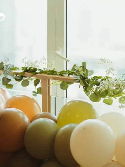 A simple yet elegant detail of a balloon arrangement with fresh eucalyptus and baby's breath. This shows how I can create beautiful decor for intimate at-home celebrations.