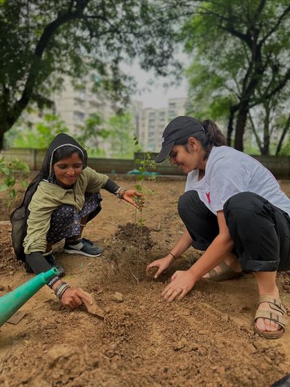 A volunteer and a member of our on-ground team work side-by-side. This collaboration between community members and our experienced staff is the foundation of our success.