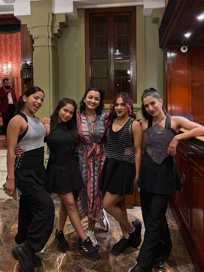 A candid moment with my amazing team after a show. We are more than just a dance company; we are a family that supports each other and shares a passion for movement.
