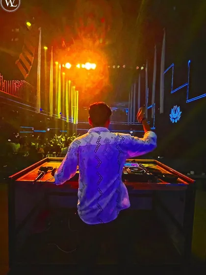 From my perspective behind the decks, welcoming the new year. This shot captures the calm before I drop the beat that ignites the dance floor.