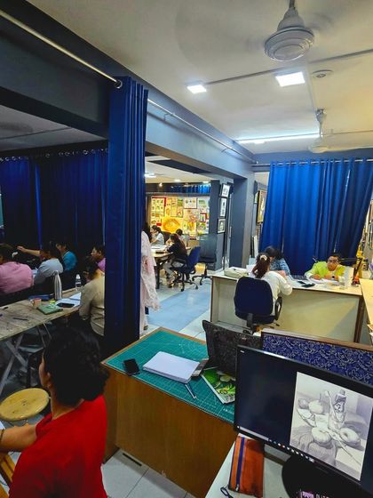 A snapshot of our spacious studio during a full class. With multiple work areas and plenty of inspiration on the walls, it's the perfect environment to learn and create.