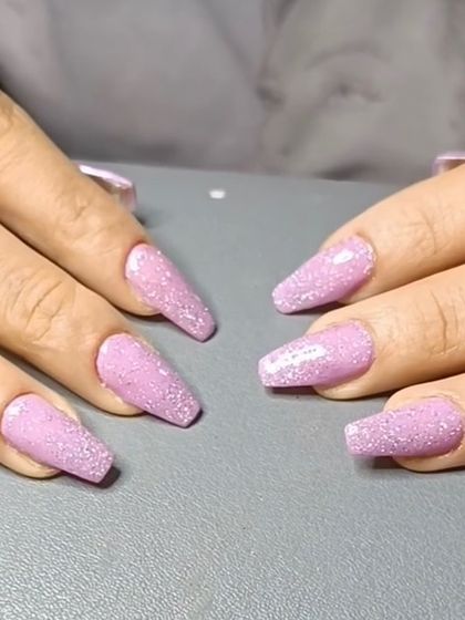 A full-coverage glitter look with coffin-shaped nails in a lovely sparkling lilac shade.