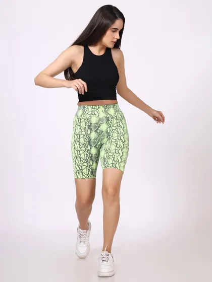 Another shot of the model walking, providing a slightly different angle of the snakeskin-print activewear set. Multiple shots like this are essential for a comprehensive e-commerce listing.