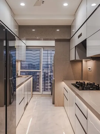 A bright and airy parallel kitchen with white glossy cabinets and integrated profile lighting. The layout is designed for efficiency, with the sink and stove on opposite counters for a smooth workflow.
