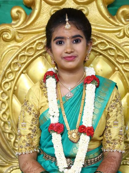 Seated for the ceremony, Niharika looks like a princess. The makeup is paired with a traditional flower garland and jewellery.