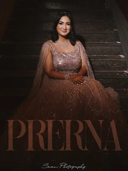 A seated portrait of the bride on a staircase, with her name elegantly displayed on the image.