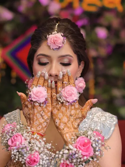 A close-up on the beautiful mehndi and the soft, shimmery eye makeup.