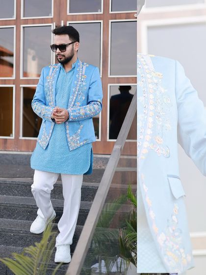 A fresh take on groomswear. This sky-blue ensemble features a hand-embroidered jacket over a textured kurta, creating a vibrant and stylish look for a sangeet or daytime wedding event.