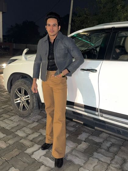 Our client Mr. Arya looking amazing in our customized tan bell-bottom jeans. This demonstrates our expertise in crafting bold, retro-inspired denim styles.