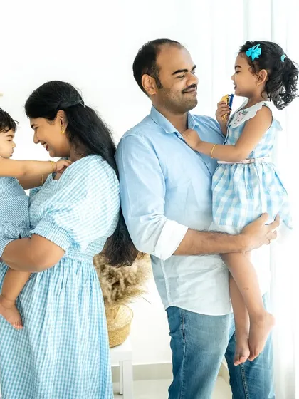 A family is a collection of individual relationships. Here, I've framed a moment showing mom with her youngest and dad with his eldest, capturing the sweet, parallel connections that exist within one beautiful family unit.