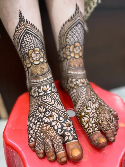 Another angle of the detailed bridal feet mehndi, showing the beautiful floral and geometric work.
