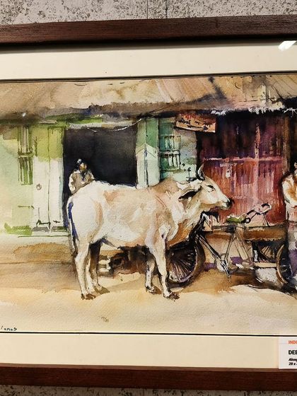 My painting, 'Along the street', framed and displayed at the exhibition in Vietnam. Seeing 'INDIA' next to my name was a moment of immense pride.
