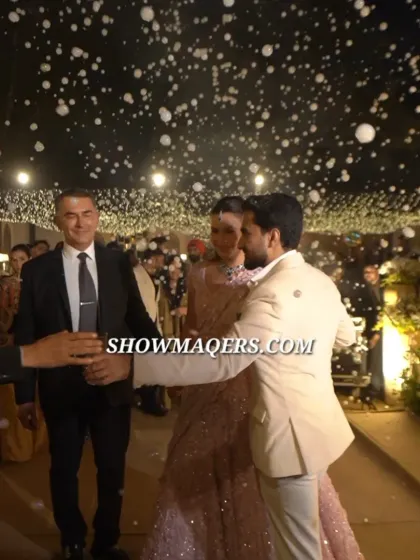 A magical moment as the couple makes their entrance through a shower of artificial snow, creating a fairytale start to their Roka ceremony.