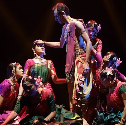 A poignant moment from "Ṛtu Vismruthi," a Chithkala Ensemble production. This scene showcases the storytelling power of group choreography, where multiple dancers create a single, powerful emotional landscape.