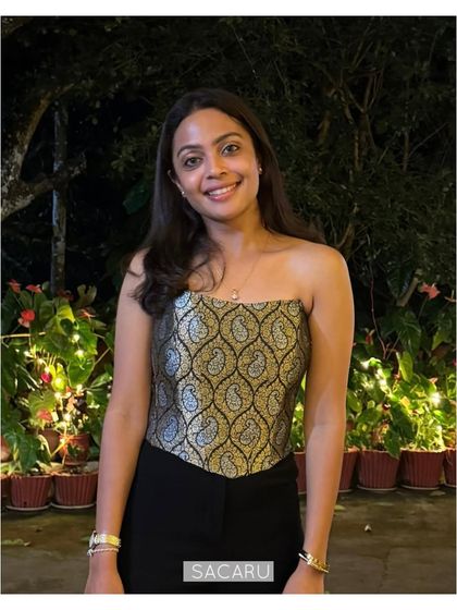 Bhavani smiling in her chic Indo-western outfit, perfect for a cocktail evening.