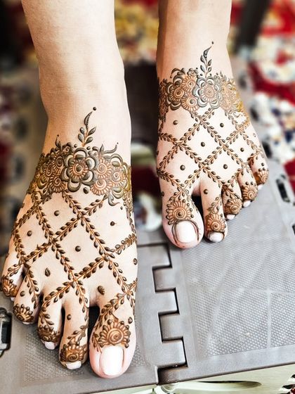 A delicate and lacy design for the feet, featuring a floral net pattern.