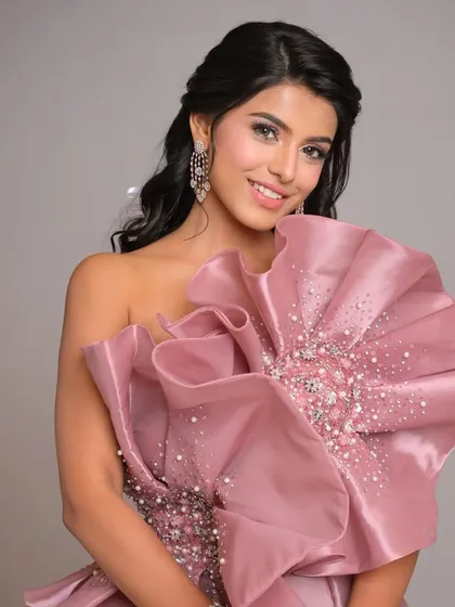 A portrait where the soft, face-framing waves are visible. The hair is styled to look effortless and romantic.