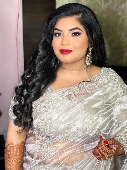 The complete look, showcasing the stunning silver saree and the classic red lip. This is a perfect example of how to create a show-stopping look for an engagement or reception.