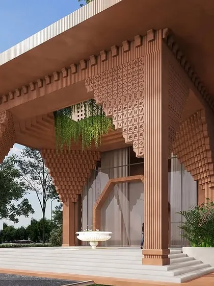 A close-up of the grand entrance, where intricately detailed pillars and arches create a powerful sense of arrival. The design is a modern interpretation of traditional temple architecture.