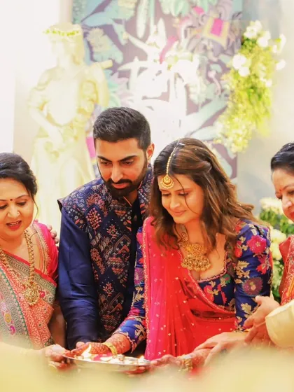 A candid moment from a pre-wedding ritual. The family gathers around the couple, showcasing the importance of tradition and togetherness that I emphasize in all my events.